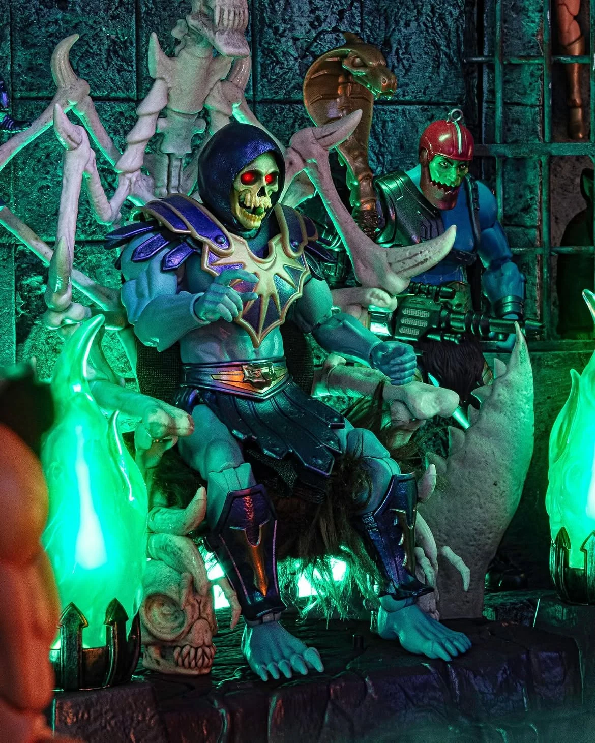 Skeletor seated on the Havoc Throne with Trap Jaw beside him