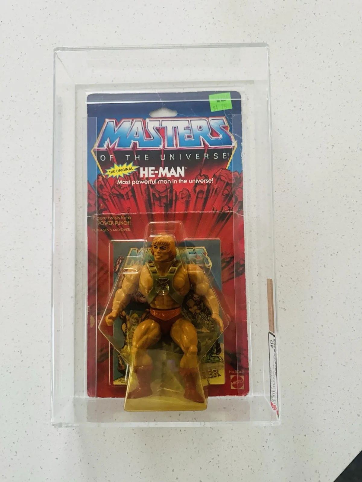 Original carded He-Man figure graded AFA Y40 in acrylic case