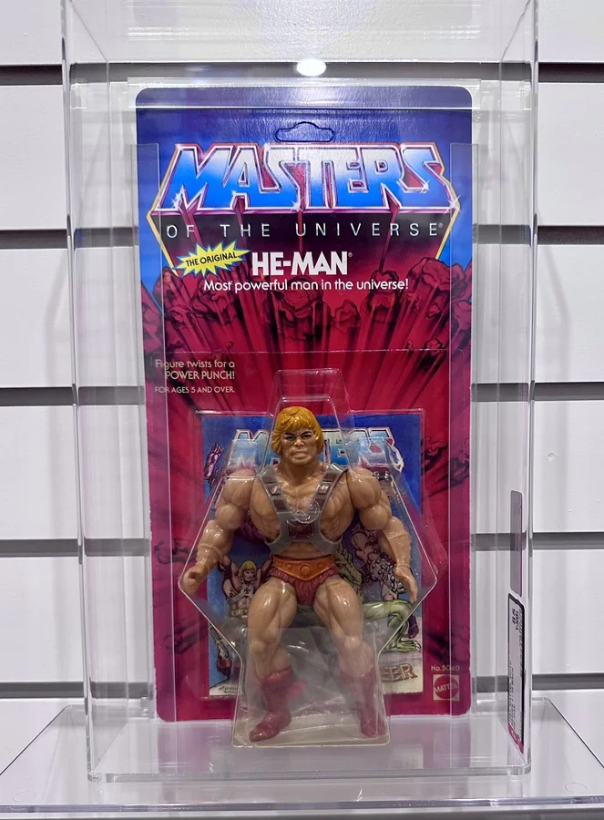 Carded 1983 He-Man figure graded AFA Y85 in an archival case