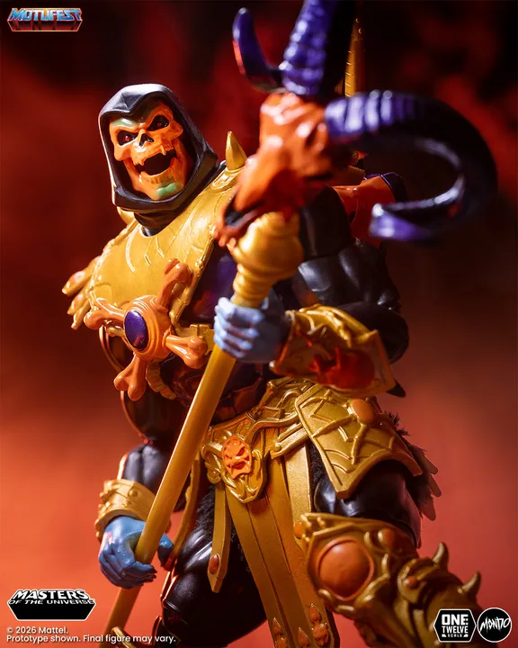 Waist up, hood raised, both hands on the Havoc Staff, with the ram skull and its purple horns filling the top of the frame.