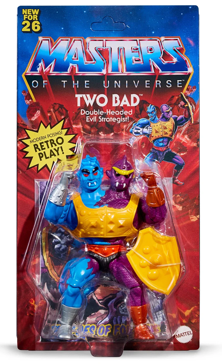 The carded Two Bad, on vintage-style packaging: a NEW FOR 26 flag in the top corner, the Masters of the Universe logo over a red rock background, the name TWO BAD above the line Double-Headed Evil Strategist, a yellow starburst reading MODERN POSING! RETRO PLAY!, the figure in the blister with its shield, and the mini comic behind it with THE FOES OF FORTUNE showing through.