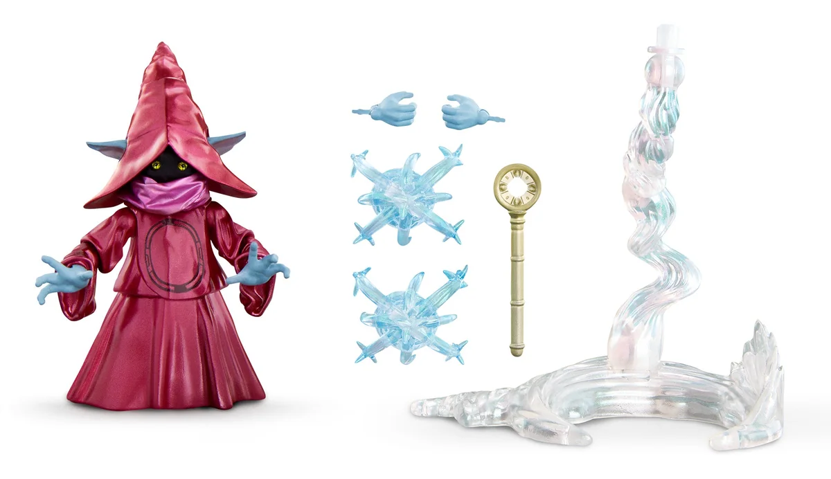 Chronicles Orko with his accessories laid out: a spare pair of open blue hands, two pale blue magic burst effects, the gold key-shaped wand, and the clear twisting float stand