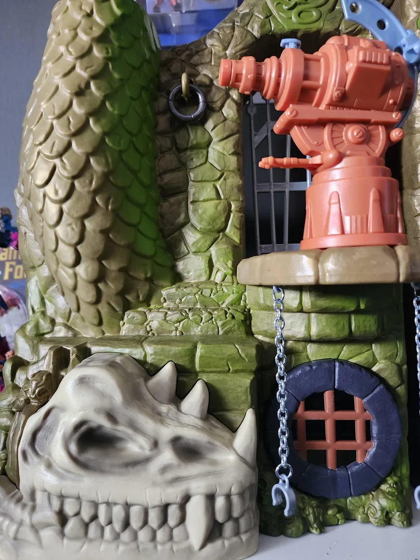 The harpoon blaster, barred cage and skull detail on the lower level