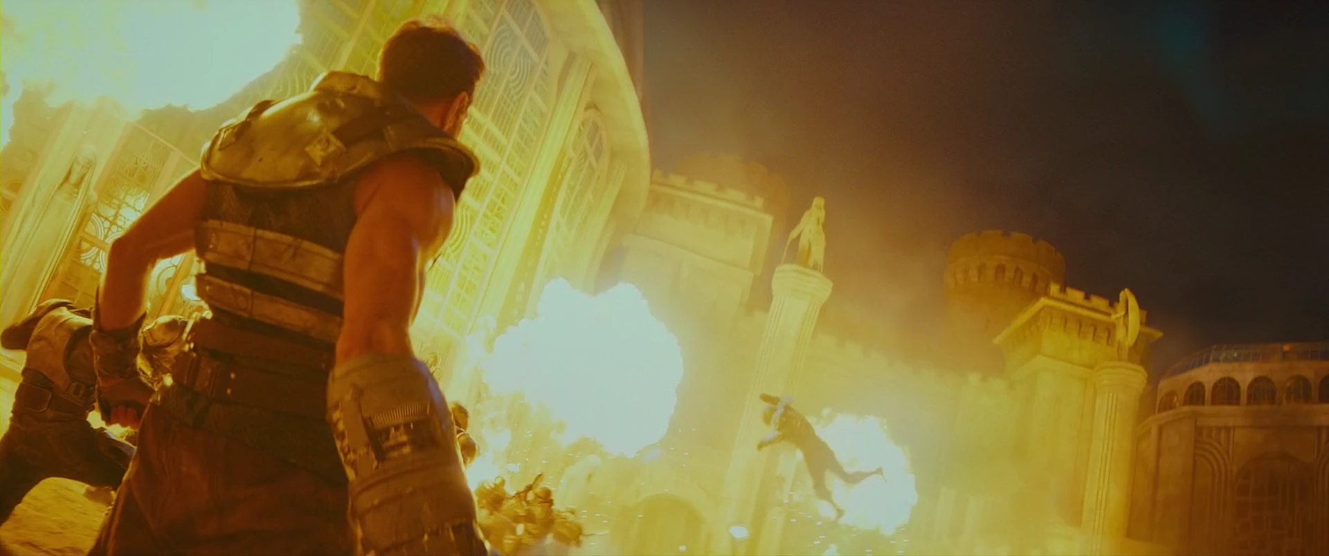 A warrior watches the palace burn as the city falls.