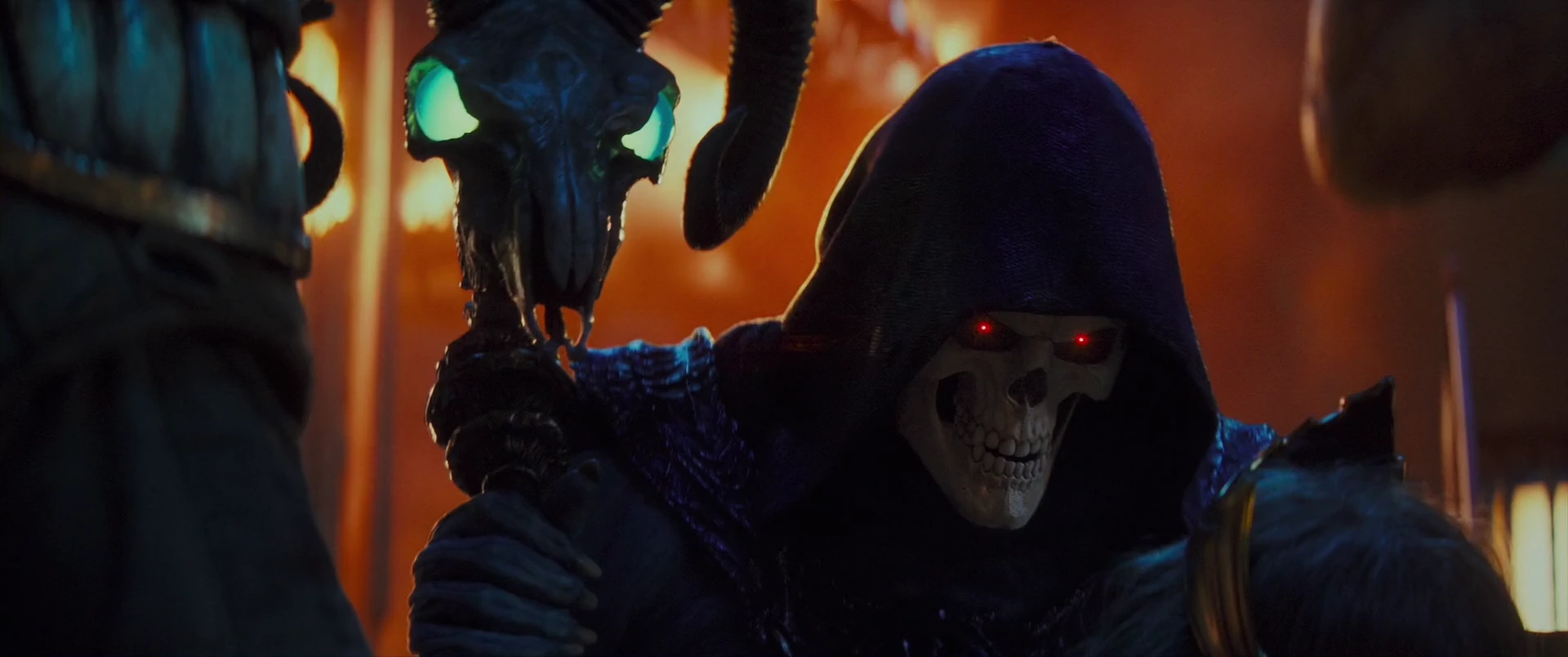 Skeletor revels in the fall of Eternos, his eyes burning red.