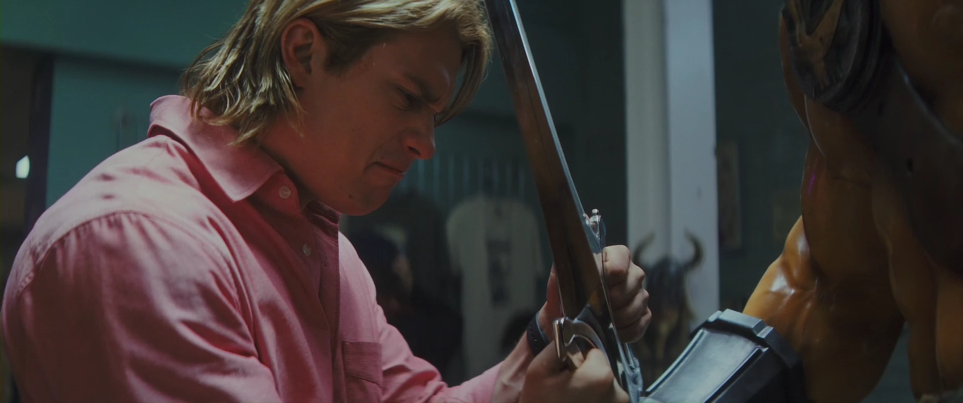 Adam finds the Power Sword set in a Conan statue and takes hold of it.