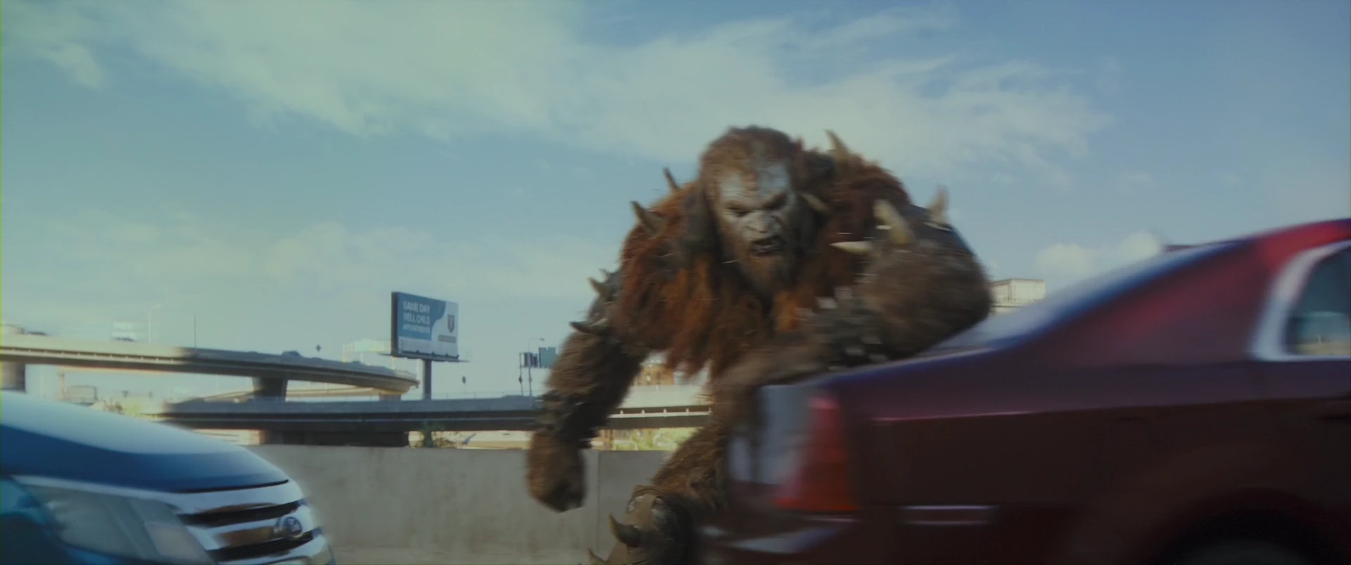Beast Man, Skeletor’s digital brute, lunges at Adam on the freeway.