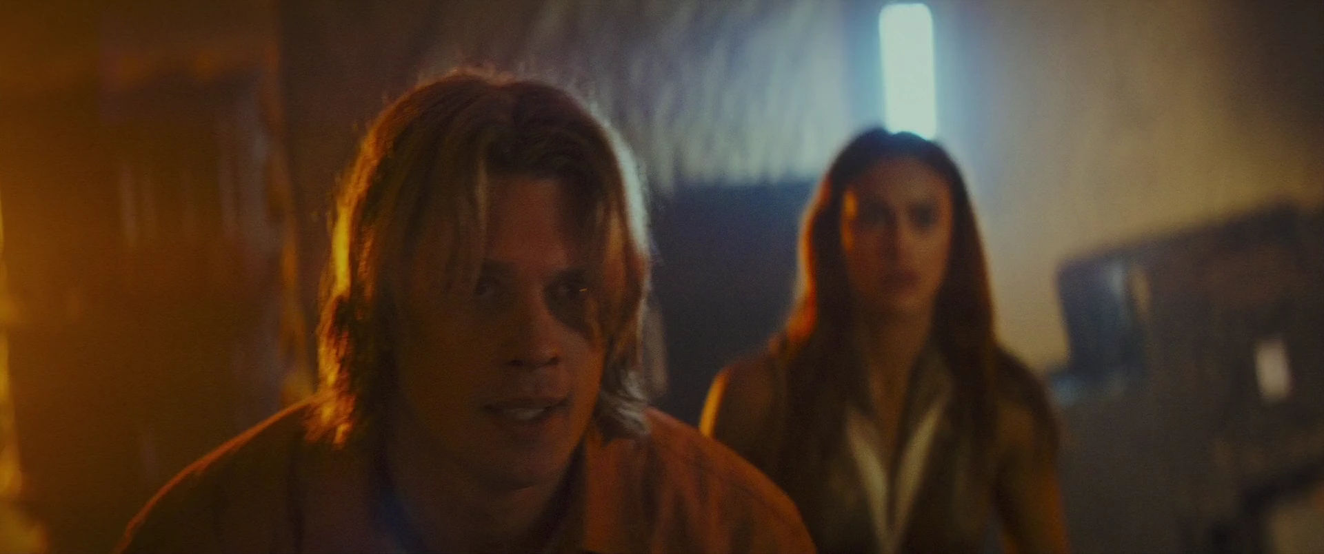 Adam and Teela in flight through the besieged refuge.
