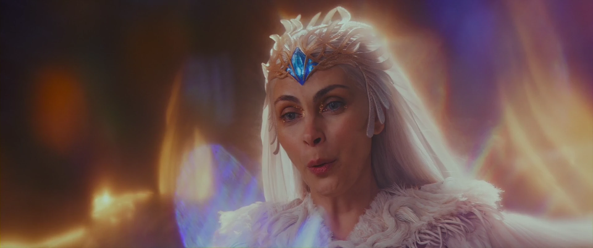 The Sorceress, guardian of Grayskull, watches over Adam from afar.