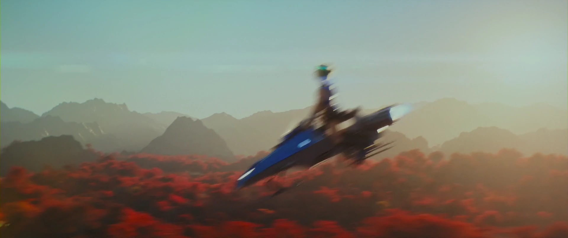 A speeder bike skims the red wilds of Eternia.