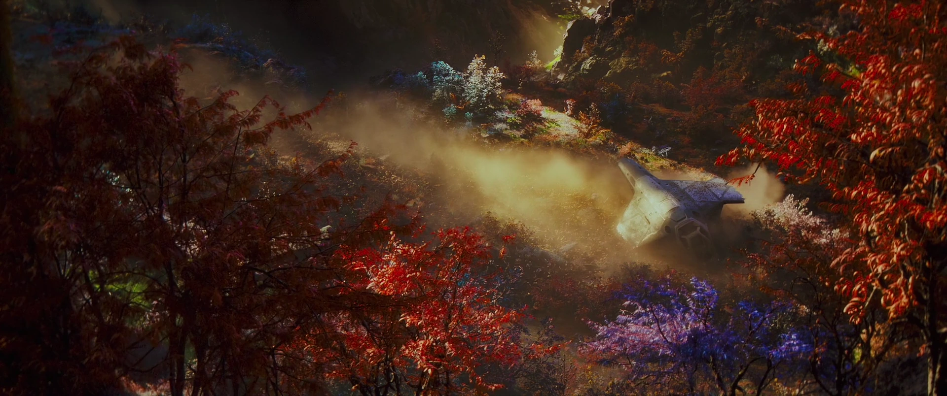 A downed ship smolders in the vivid forests of Eternia.