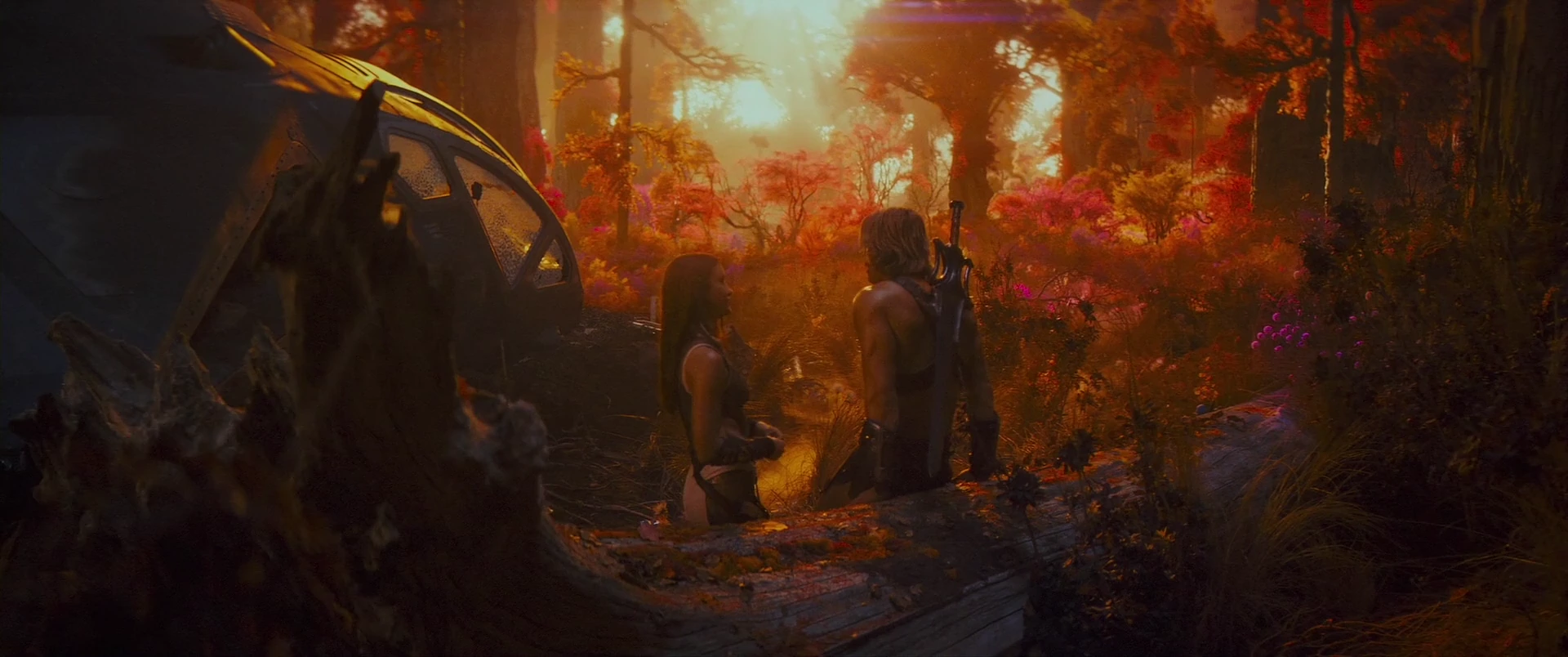 A still moment between Adam and Teela in the glowing forest.