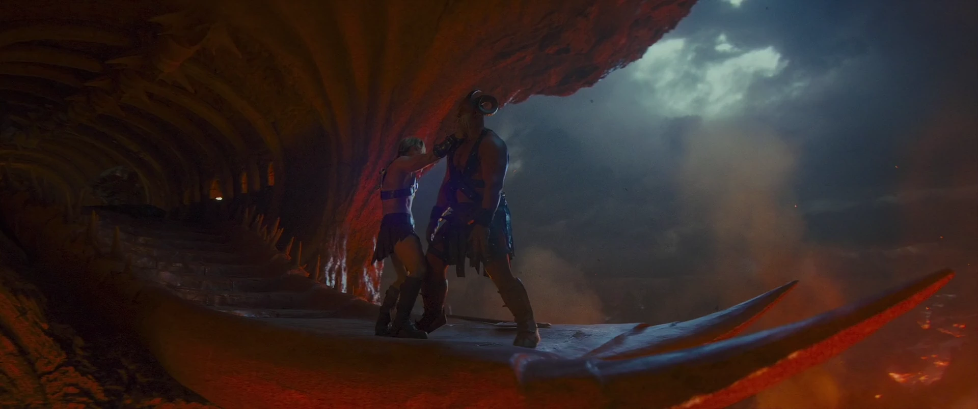Combatants grapple on the skull jaw above Snake Mountain’s lava.
