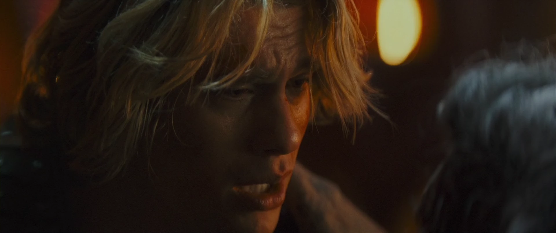 Adam in the firelight of Snake Mountain, the fight closing in.