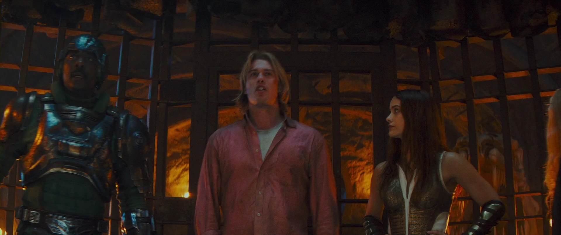 Adam between Roboto and Teela in the dungeon cell.