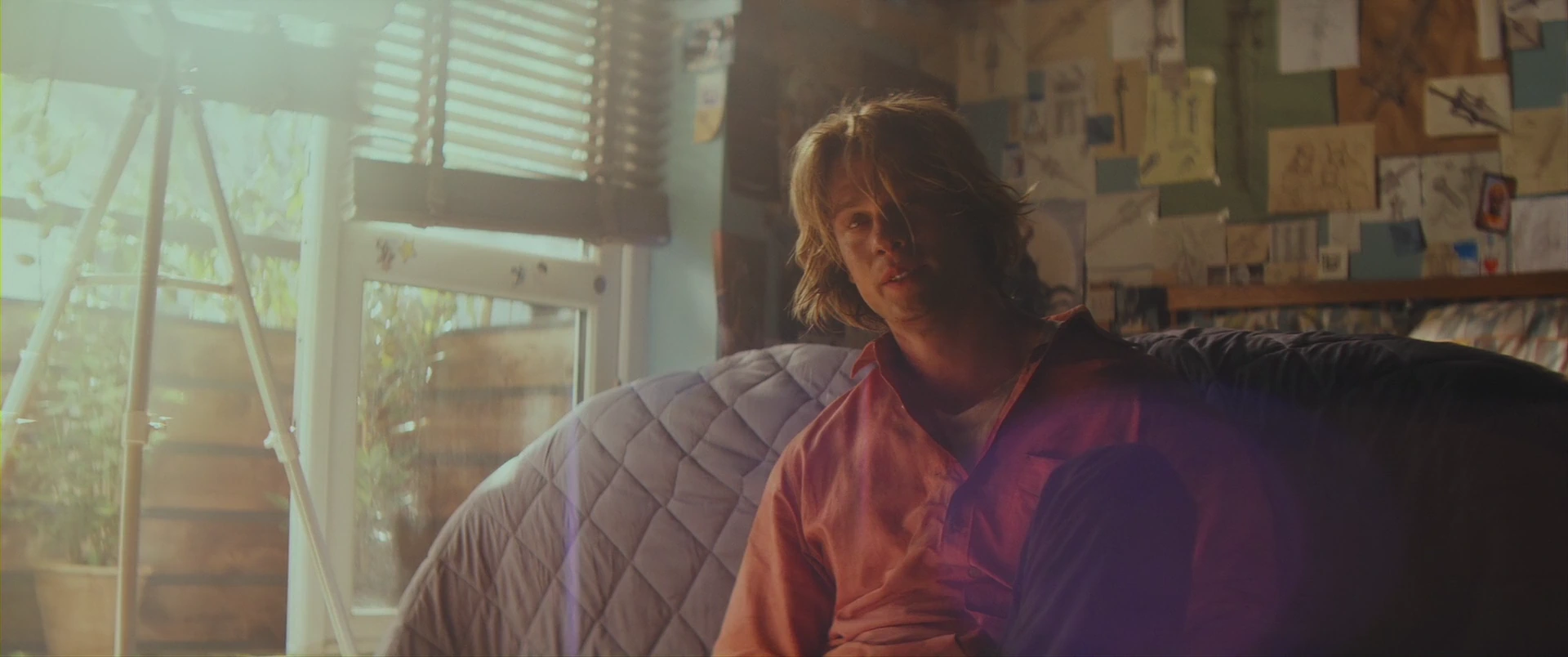 Adam in the false comfort of his Earth apartment, fighting to wake.