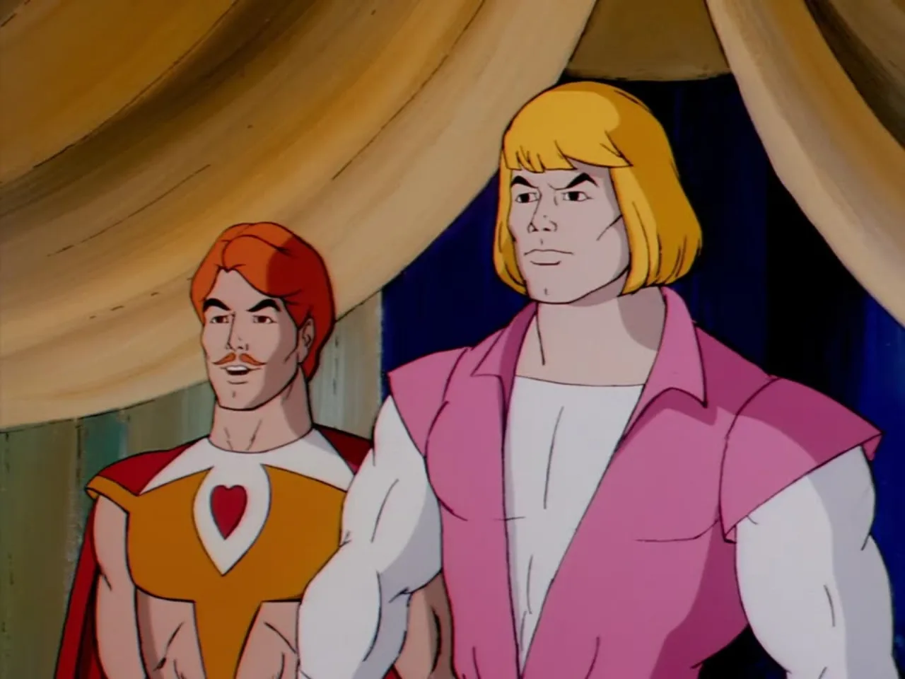 Prince Adam and Bow stand beneath a golden curtain inside a tent looking offscreen.