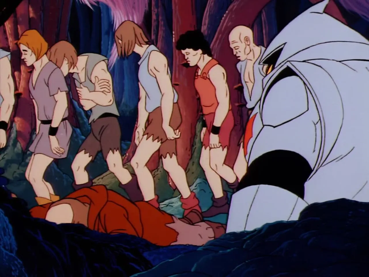 More captive villagers trudge past a fallen figure on the ground while a Horde Trooper looms nearby