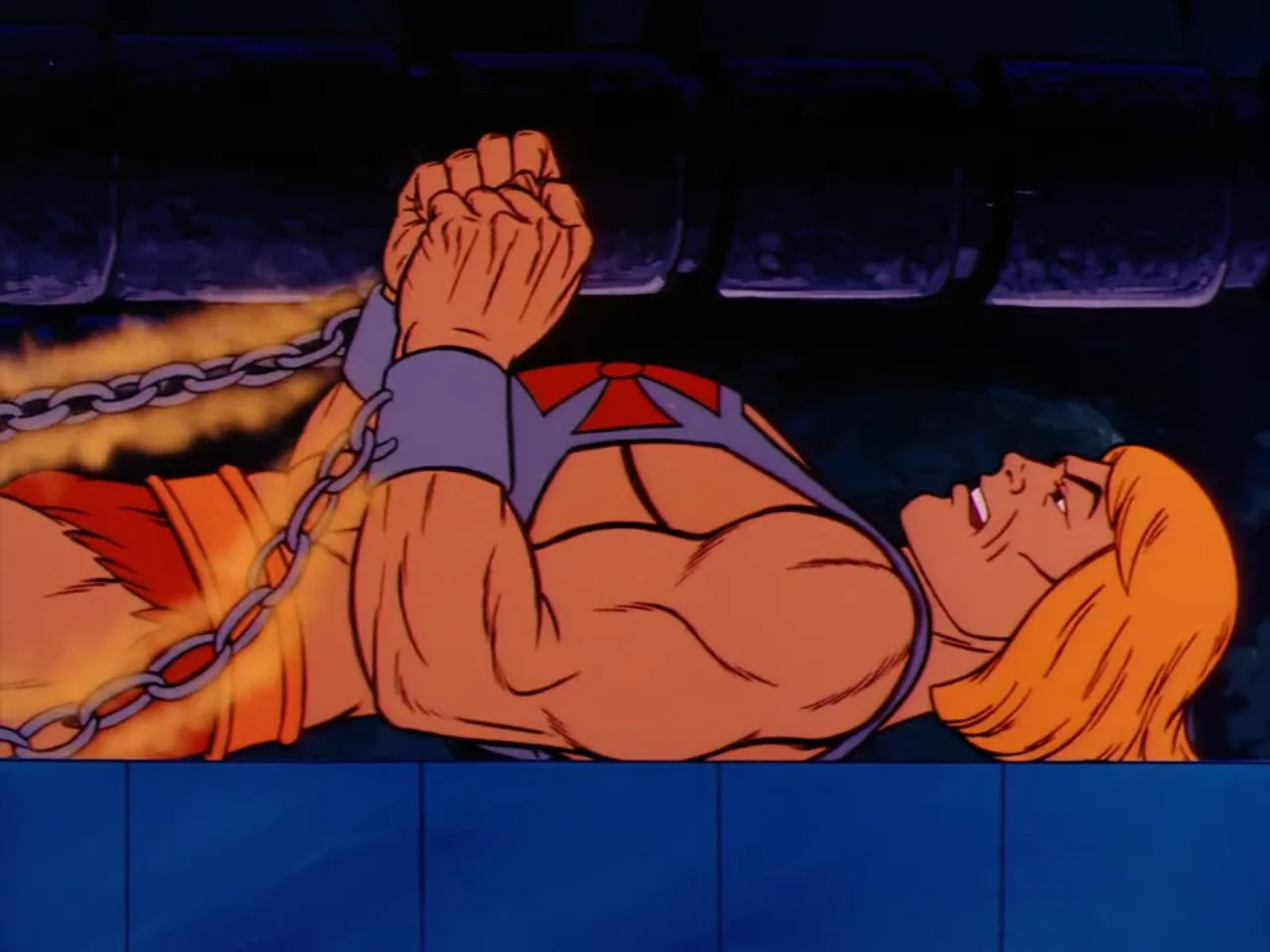 Prince Adam lies bound with glowing chained wrists straining against his restraints