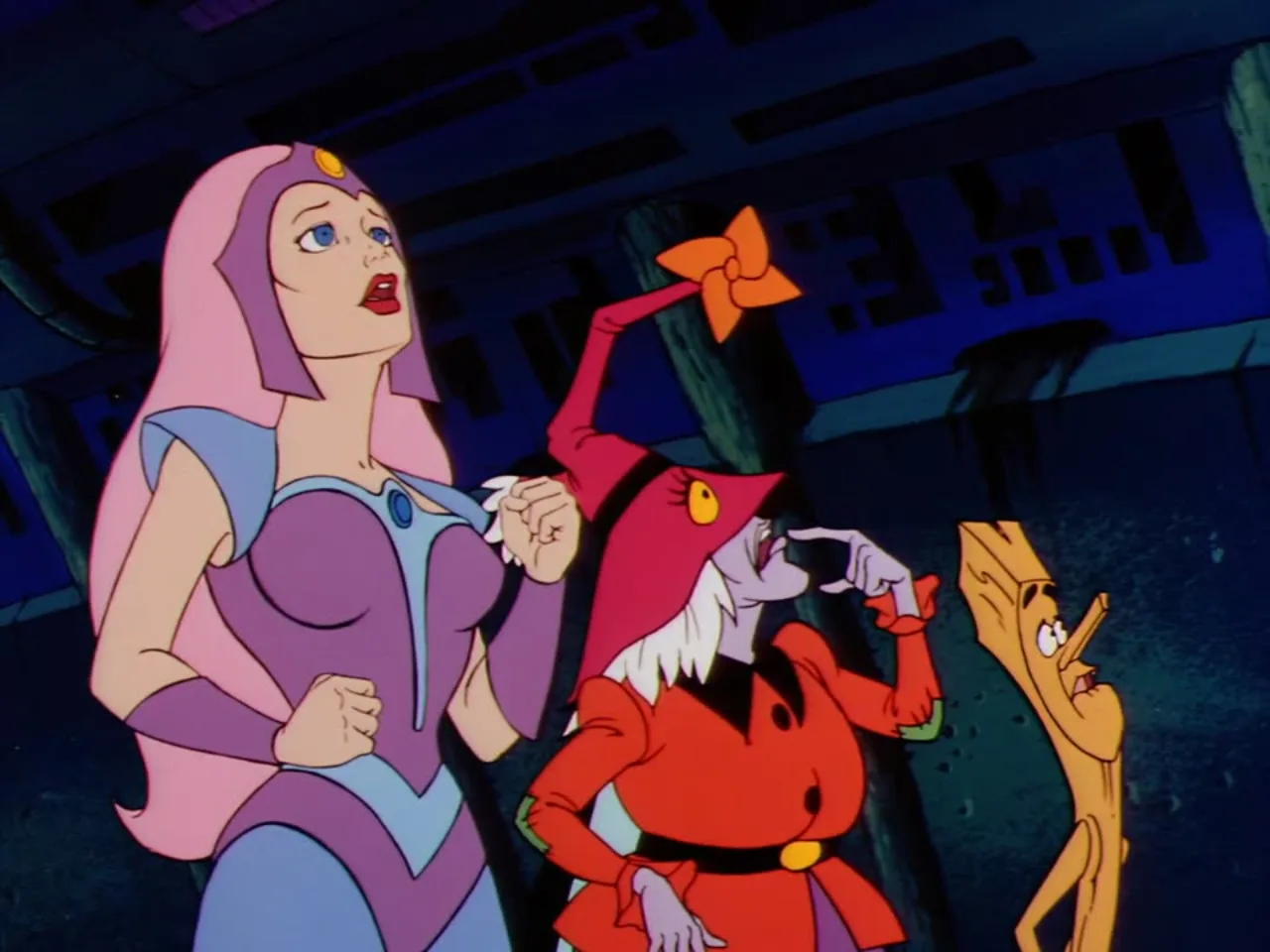 Castaspella clenches her fists while Madame Razz and Broom gesture animatedly beside her