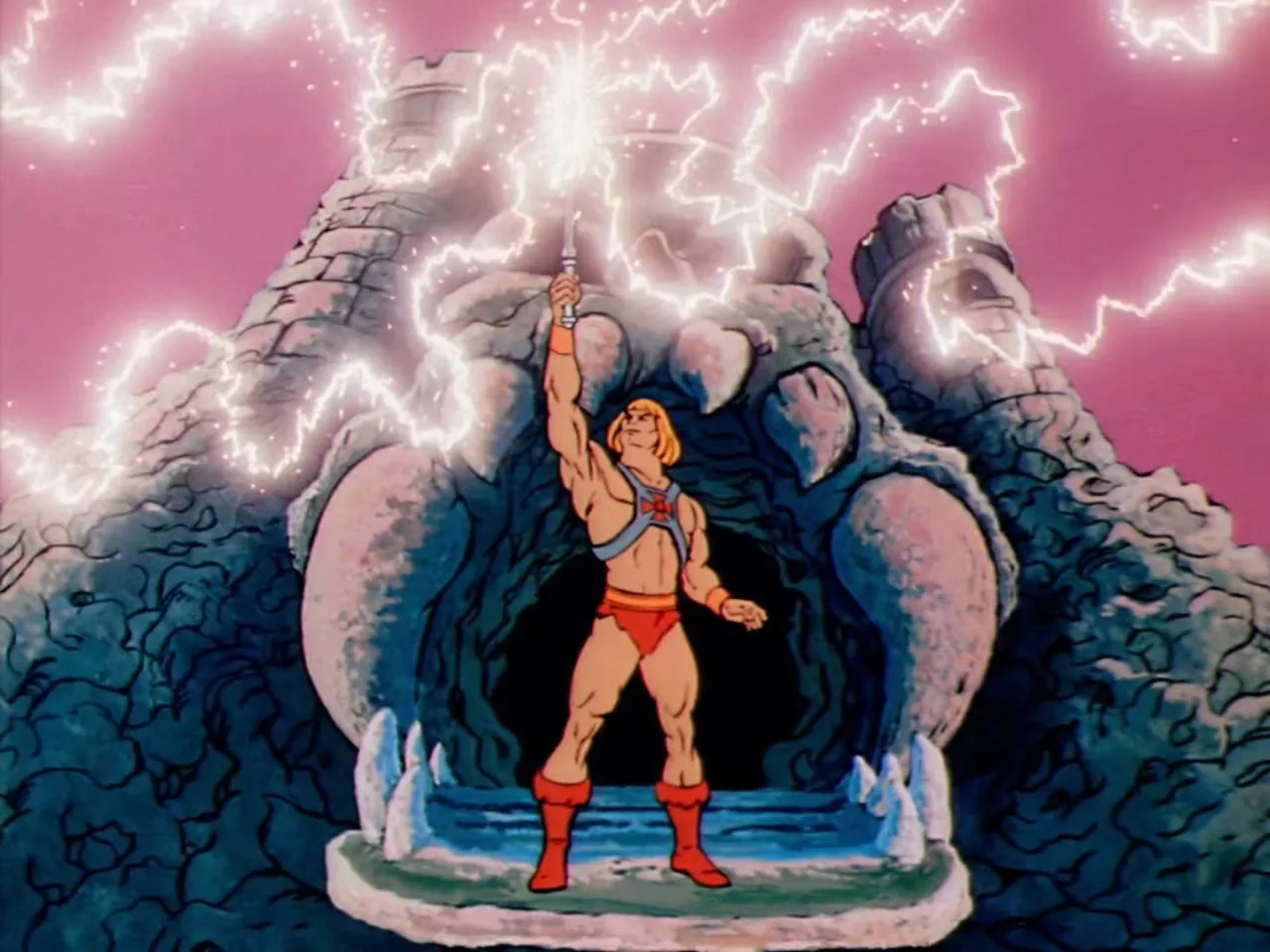 He-Man raises his sword high as crackling lightning bursts around him before the jagged stone face of Castle Grayskull.
