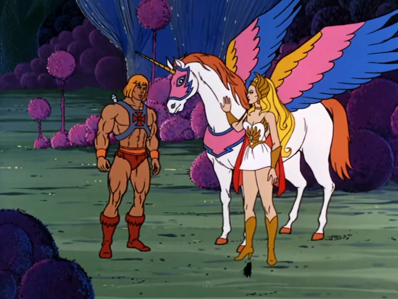 He-Man stands beside She-Ra and the winged unicorn Swift Wind amid the pink foliage of the Whispering Woods.