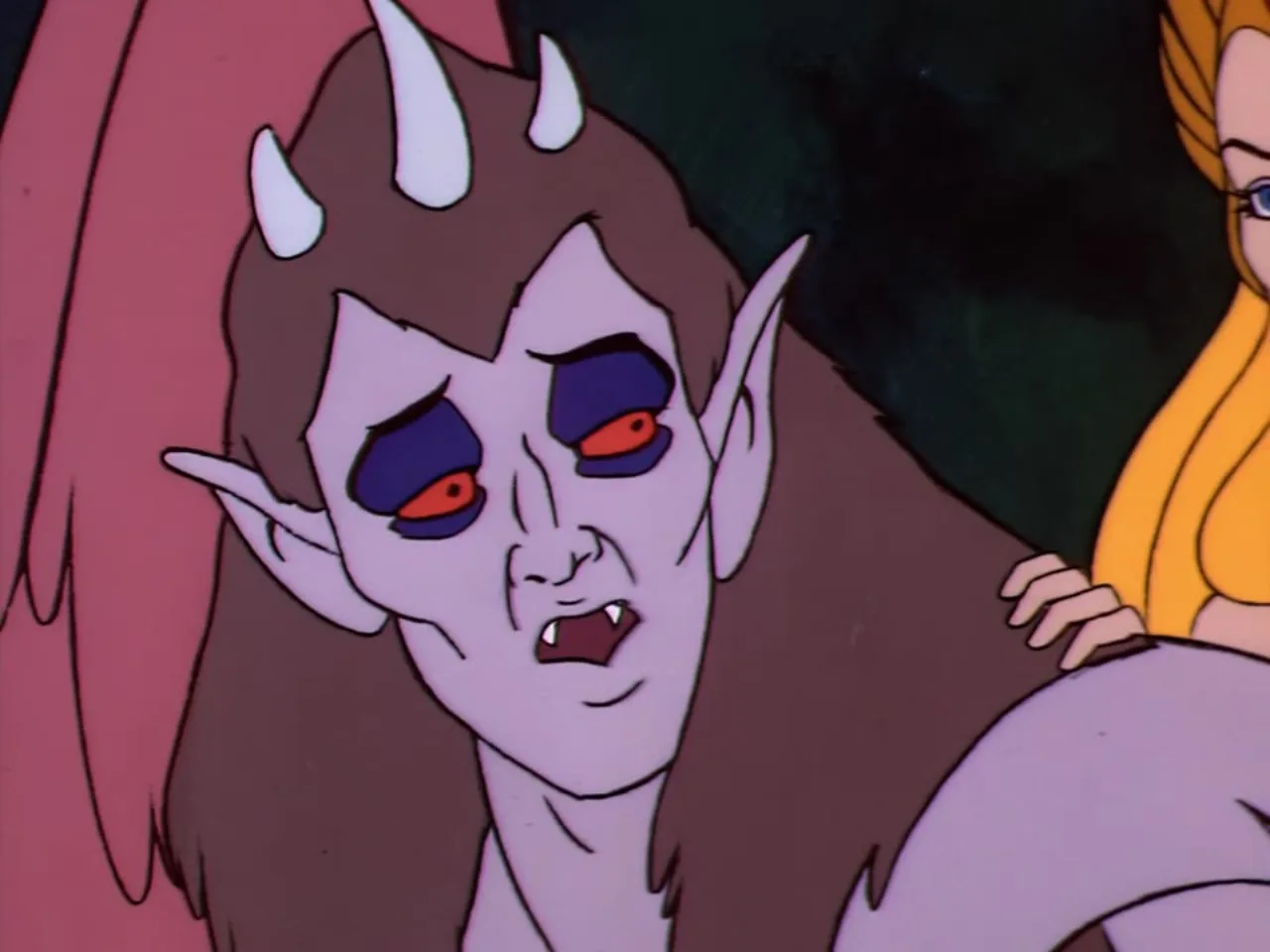 A snarling horned demonic creature with red eyes and fangs looms in close up as She-Ra reaches toward it from the side.