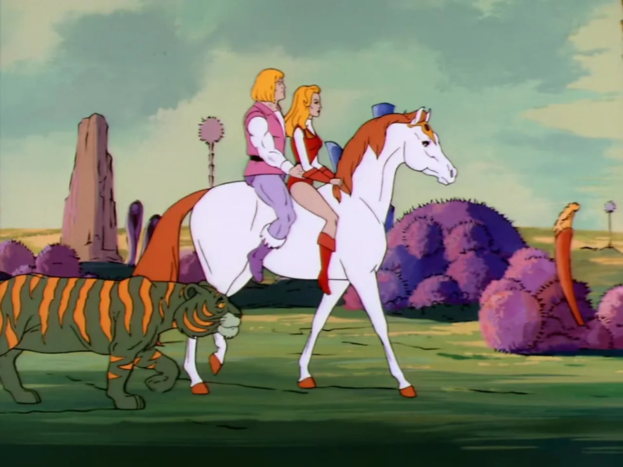 He-Man and She-Ra ride Swift Wind through the open countryside with Battle Cat running beside them.