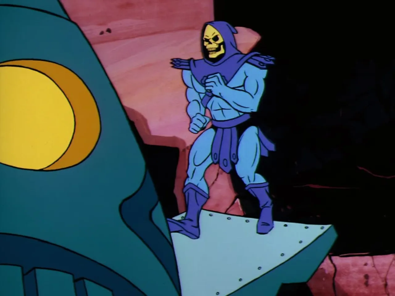 Skeletor stands balanced on the wing of a flying vehicle against a dramatic pink and orange sky.