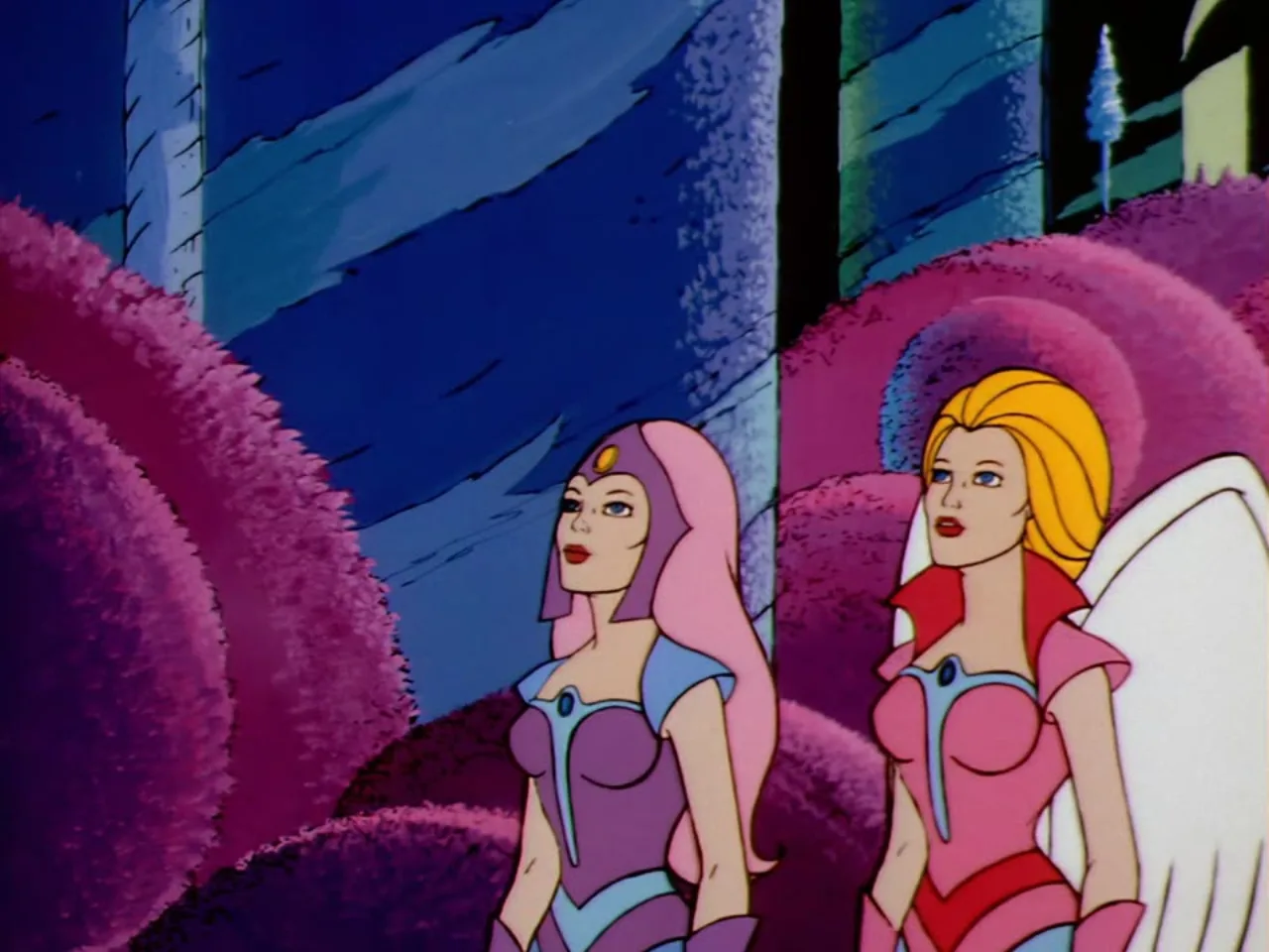 Castaspella and a winged woman stand together against a deep purple backdrop.