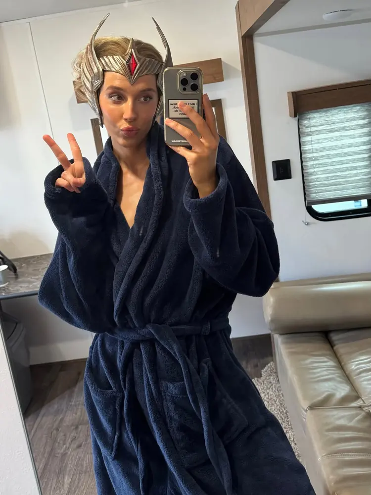 Lauren Saliu wearing the She-Ra crown between takes