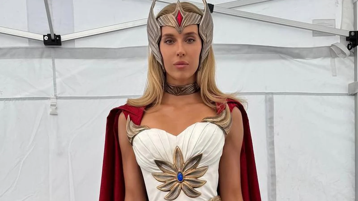 The She-Ra costume from Masters of the Universe (2026): winged tiara, gold sunburst breastplate and red cape