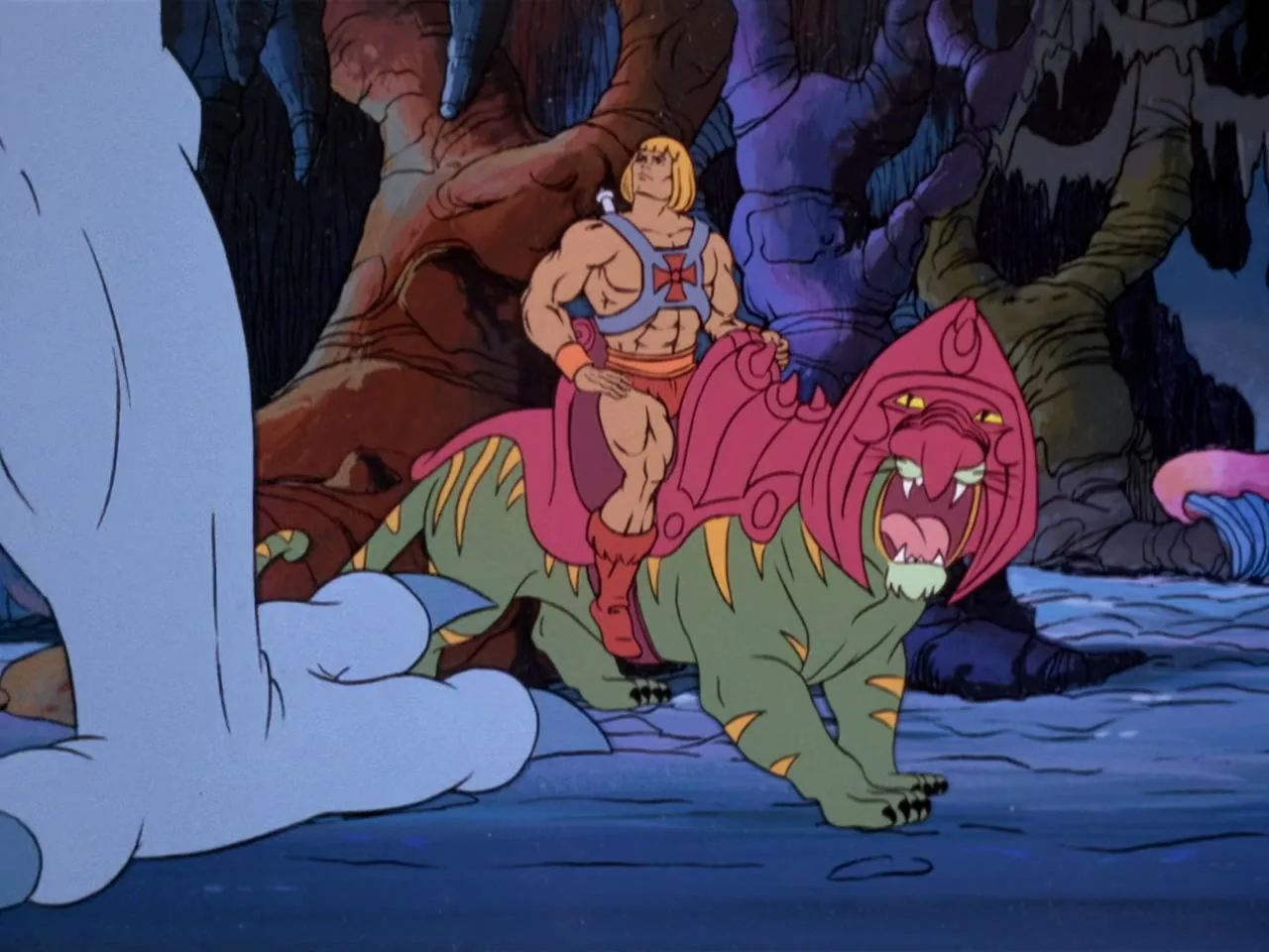He-Man rides Battle Cat through a cavern interior as they press toward the creature visible at the right edge.