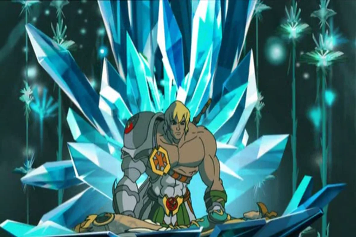 He-Man kneels in a crystal chamber over the fallen Sorceress