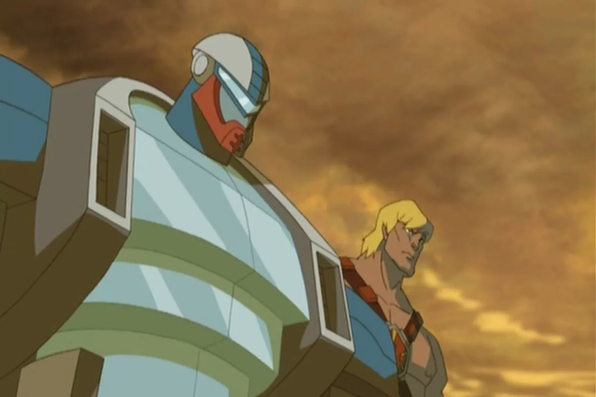 Roboto towers over He-Man, who glances back beside him