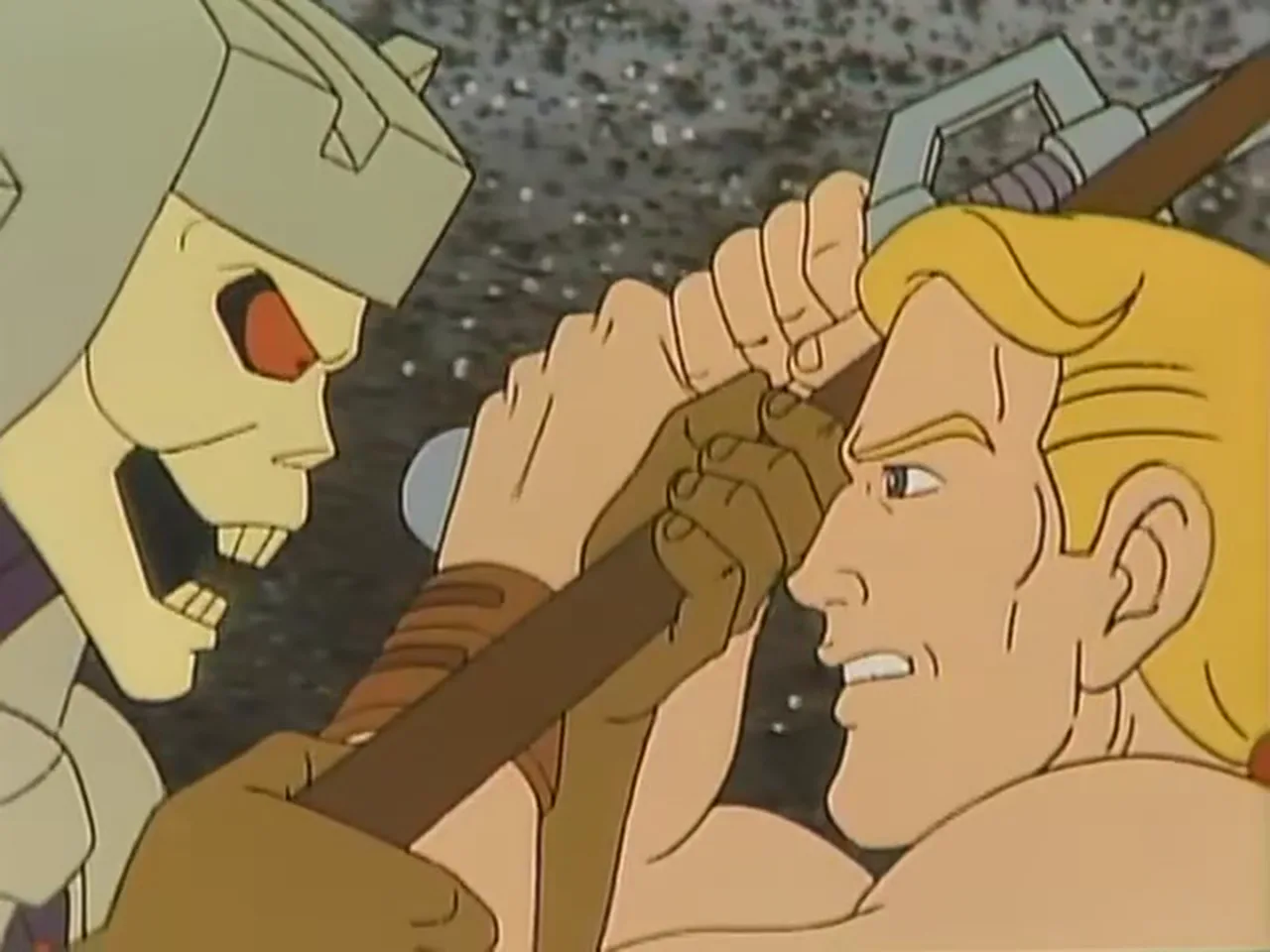 He-Man and Skeletor strain against each other over a staff.