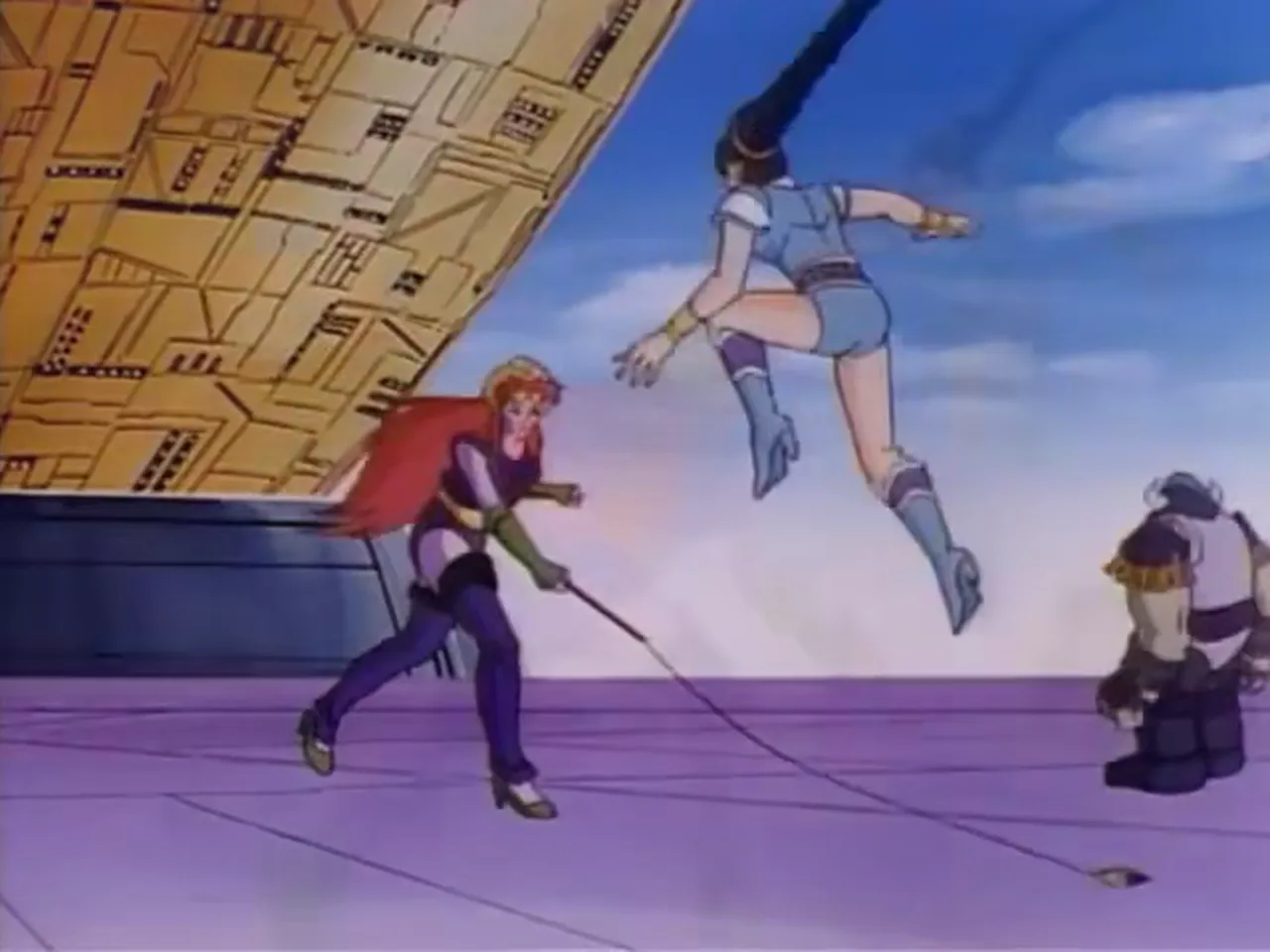 The red-haired woman cracks her whip as Mara leaps through the air in front of a gold building.