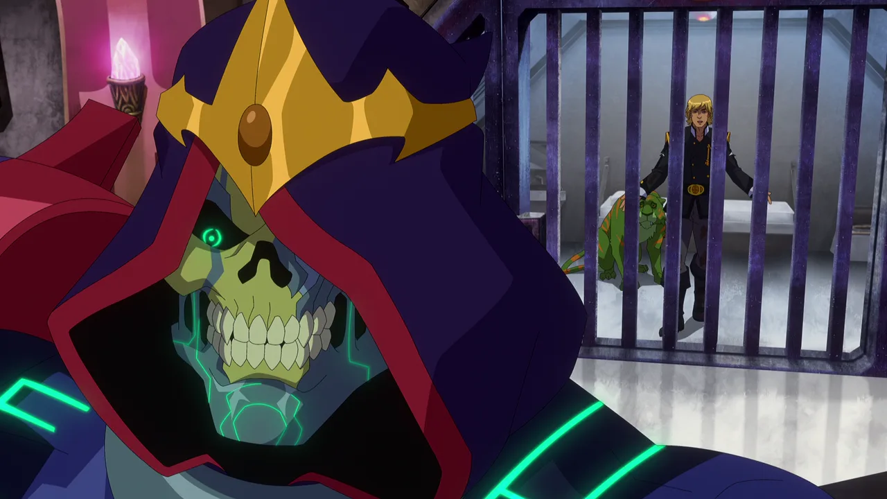 Skeletor stands before the cell bars while Adam and Battle Cat watch from inside.