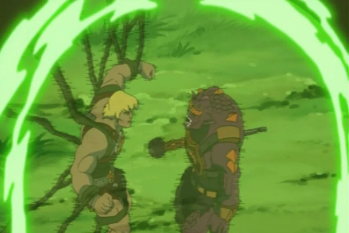 He-Man and a spiked monster grapple inside a glowing green ring