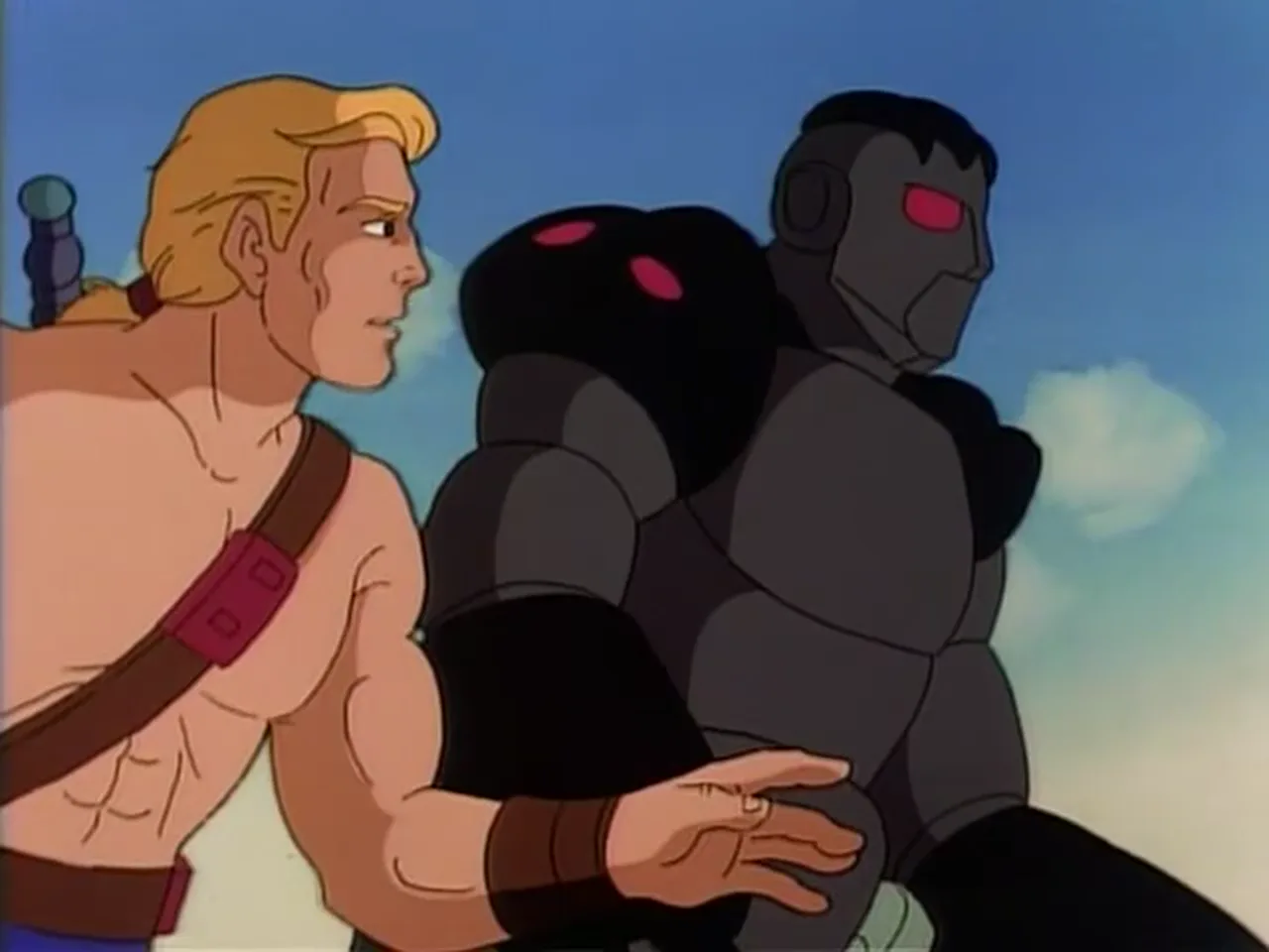 He-Man reaches out toward Cog.