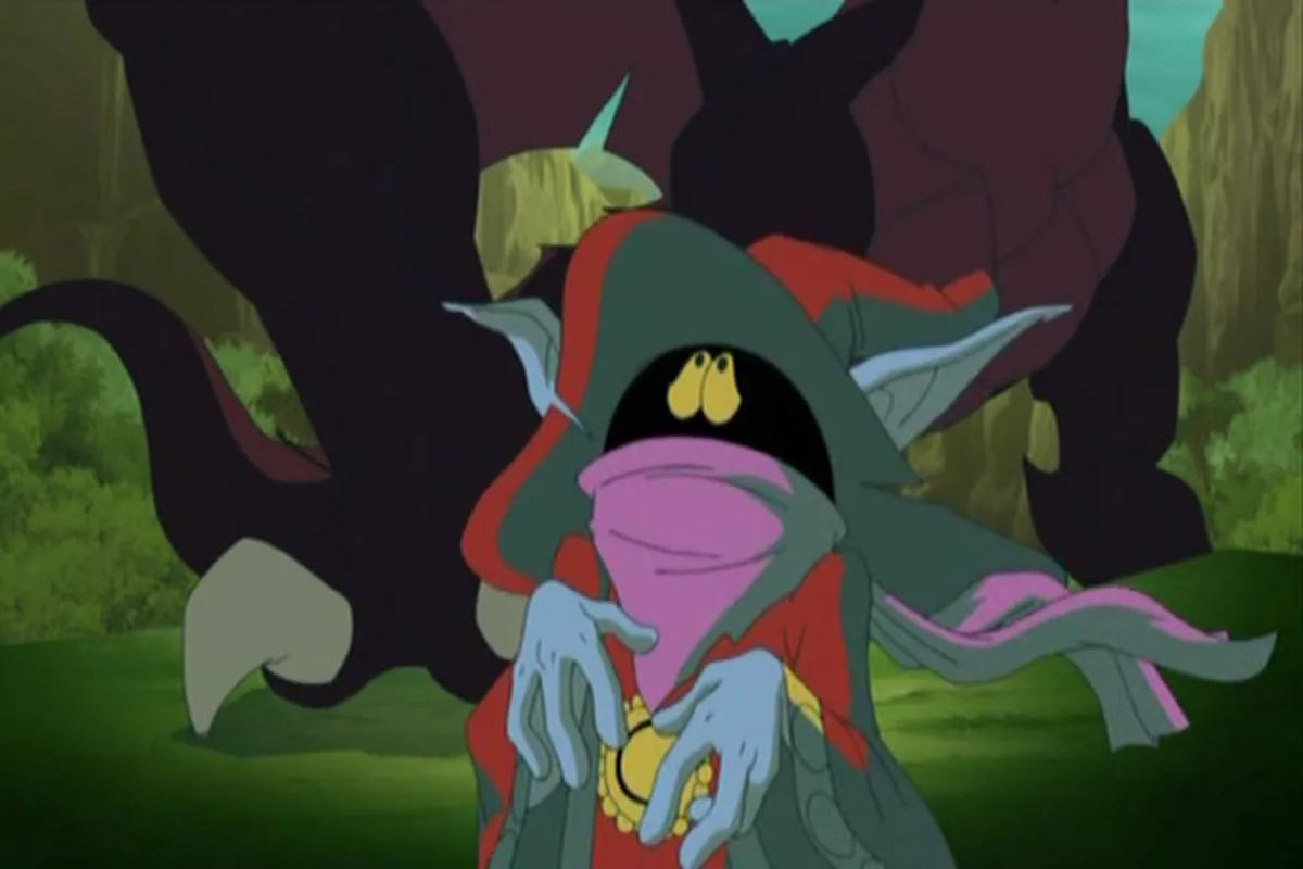 Orko spreads his hands before the huge dragons